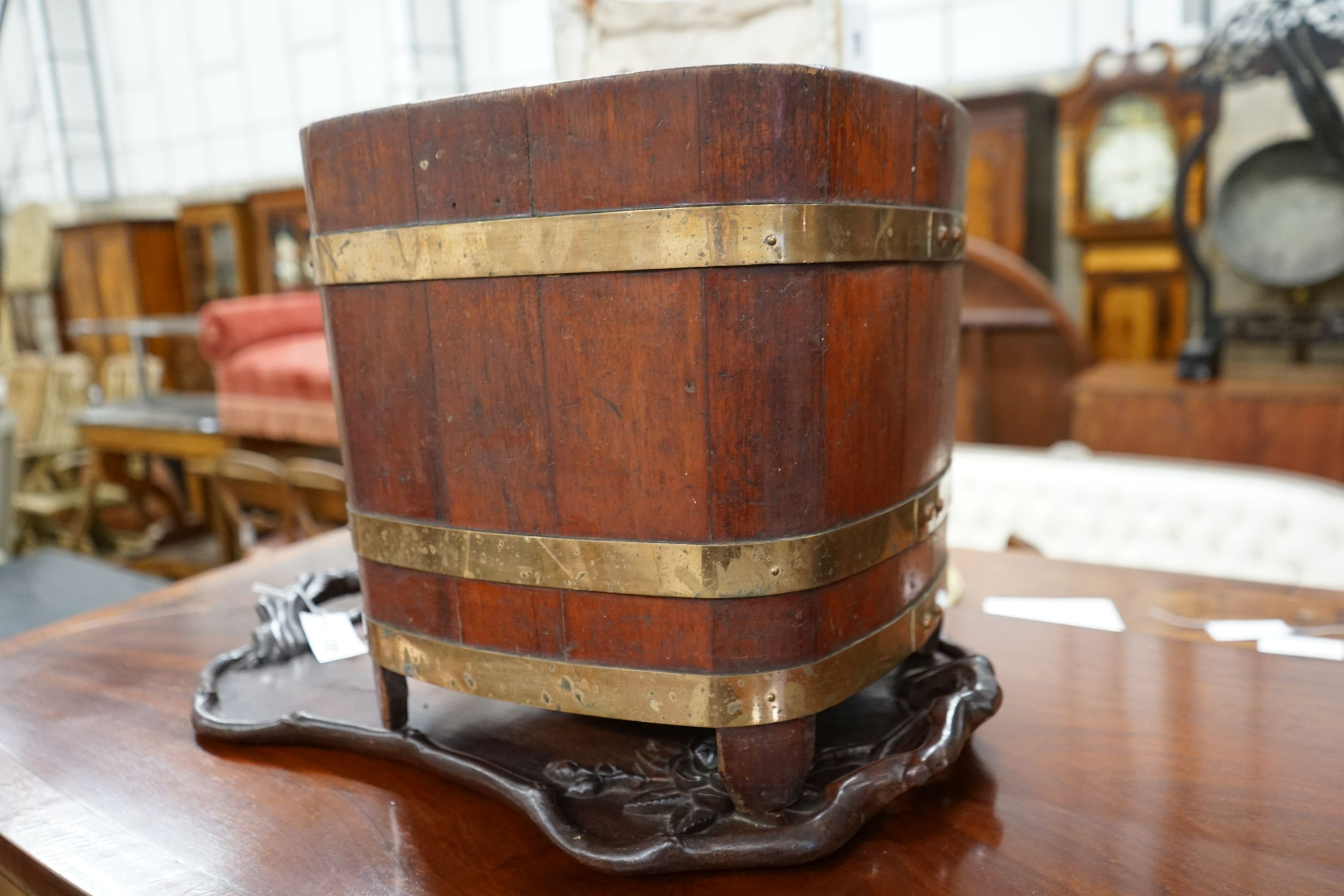 A brass bound staved mahogany waste paper bin, width 35cm, height 36cm together with a Chinese carved hardwood tray